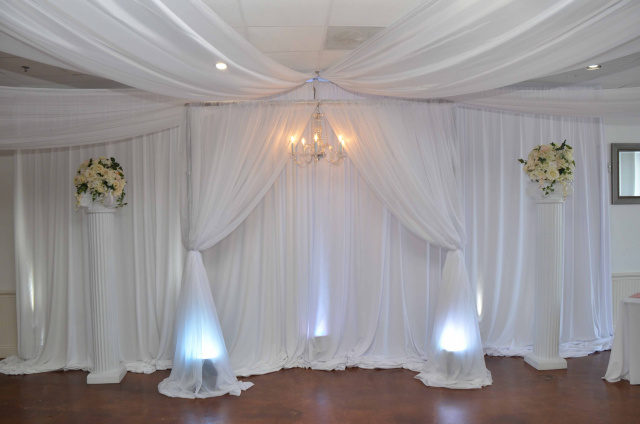 Eventfully Yours Venue in Dallas/Fort Worth Texas microwedding setup with white pillars and draping